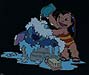 Lilo gives Stitch a bath.