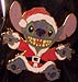 Stitch dressed as Santa.